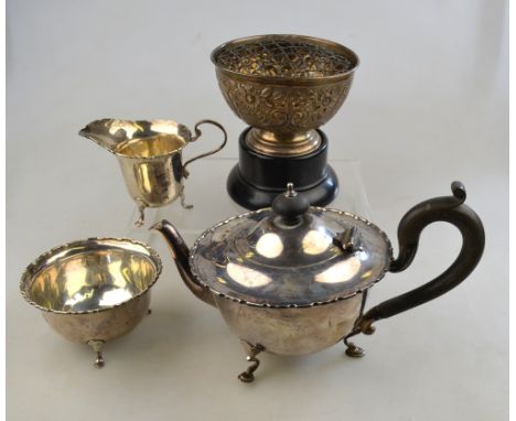 A silver three-piece tea service on hoof feet, Adie Bros. Birmingham 1921, 15.2 oz (a/f), to/w a small rose-bowl on ebonised 