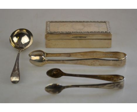 An Edwardian silver trinket box with engraved cover, London 1907, to/w a pair of Georgian sugar tongs, London 1803, a George 