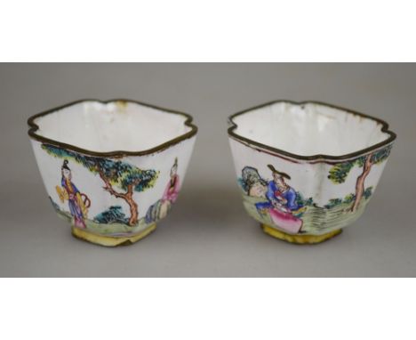 A pair of Chinese Canton enamel small wine cups, one decorated with a man in a window, women in garden and calligraphy, the o