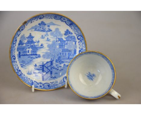 An early 19th century blue and white willow pattern tea service bordered with gilt and comprising ten teacups and ten saucer 