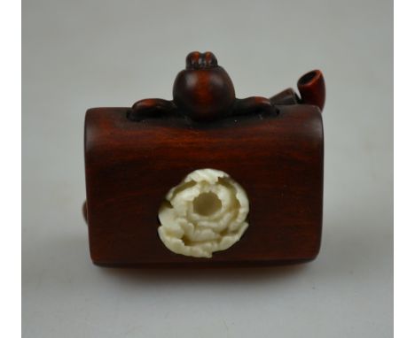 A Japanese wood netsuke carved as a tobacco pouch and kizerizutsu, signed with two character signature, late 19th century, 4.