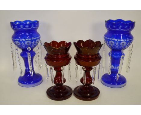 A pair of blue flash glass lustres, 37 cm h. to/w a pair of Bohemian ruby glass lustres, 27.5 cm h. (4) Condition Report Ruby