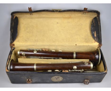 Two burr walnut clarinets with nickel mounts, by Weaver & Dickson and J. R. Lafleur & Son - both London makers - in leather c