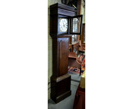 An 18th century eight-day mahogany crossbanded oak longcase clock with square brass and silvered dial having an arched date a