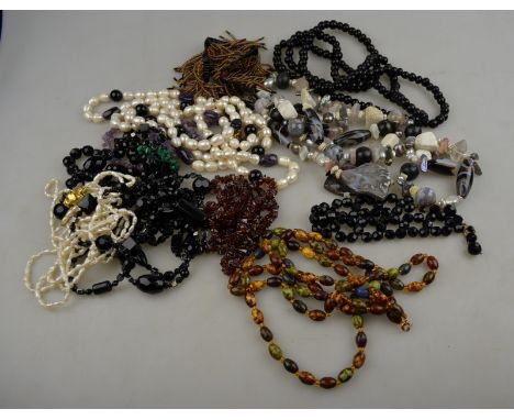A collection of mostly long rows of necklaces including fresh water pearl, agate, amethyst etc