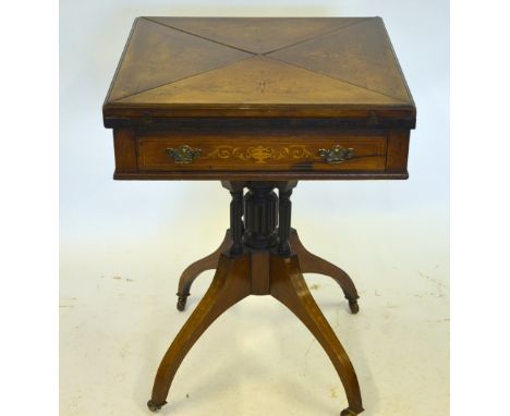 A Victorian satinwood inlaid rosewood envelope card table with frieze drawer, raised on turned gadrooned cluster supports on 