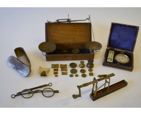 A set of folding sovereign scales in brass case, to/w a pair of antique brass spectacles, a pocket barometer and ivory-backed