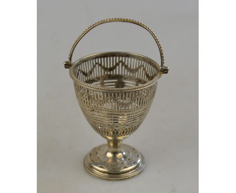 A George III pierced silver sugar basin with beaded swing handle and stemmed foot, Benjamin Davis, London 1819, 3.9 oz (lacks