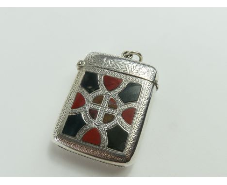 A silver vesta case, smooth on one face, and on the other with thistles and links, and a Celtic cross design in the centre, s