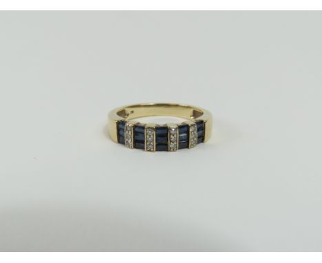 An unusual sapphire and diamond band ring, the baguette cut sapphires set horizontally with bars set with round diamonds betw