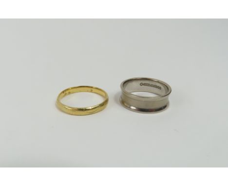 An 18ct yellow and white gold spinning ring (now separated), finger size J 1/2 centre, by Charles Green & Son, 5.76g gross