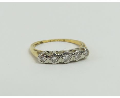 A diamond five stone ring, marked '18', finger size L, 2.19g gross