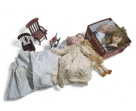 A porcelain doll in a lace trimmed dress, together with other dolls, doll's house furniture and other items