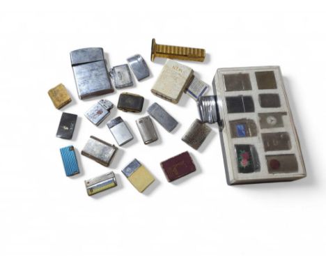 An interesting collection of cigarette lighters including one shaped as a spark plug, German made with enamel plaque "Mastico