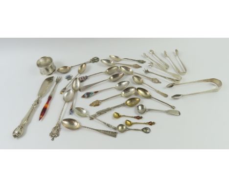 A large collection of mostly silver, with some silver plate and white metal teaspoons, tongs, shovels, a napkin ring and fish