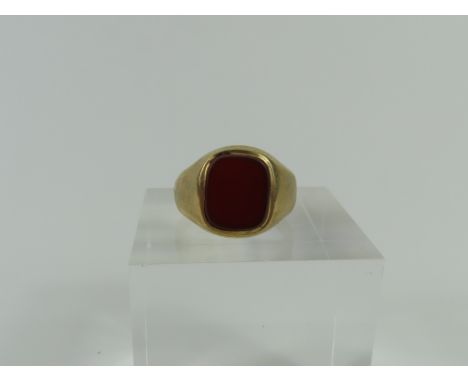 A 9ct gold signet ring, set with a rectangular shaped carnelian, finger size I, 2.86g gross