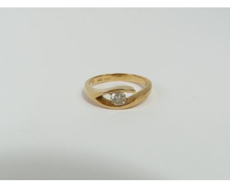 A diamond solitaire ring, the round brilliant cut stone in an open setting, the diamond approximately 0.25ct, marked '585 14k
