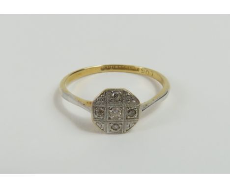 An early 20th century diamond set plaque ring, marked '18ct plat', finger size O, 1.9g gross