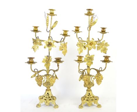 Pair of gilt metal and grapevine decorated five light candelabra, 60cm high,.    
