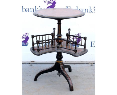 Early 20th century amboyna and ebonised reading stand with round top (diameter 40cm) above three prong book stand  on turned 