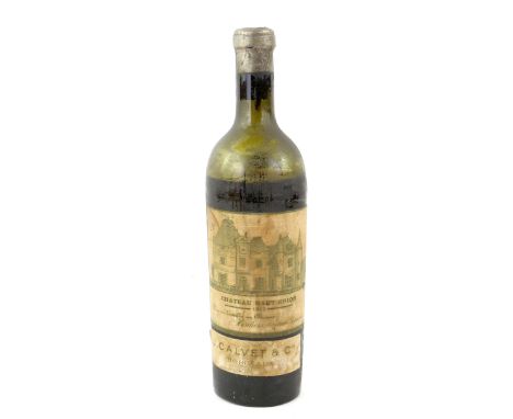 One bottle of 1913 vintage Chateau Haut Brion Bordeaux, J. Calvet &amp; C. Level below shoulder. With wooden cannon shaped bo
