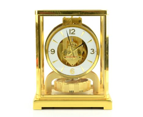 Jaeger LeCoultre Atmos 8 day clock, in gilt metal and glass case, 18 x 22 x 13.5 cm.    Generally in very good condition. We 
