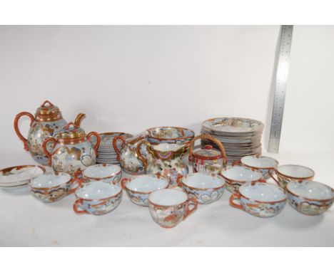 QTY OF KUTANI WARES INCLUSING TEAPOT AND COVER, TWO JUGS, QTY OF SIDE PLATES CUPS AND SAUCERS AND SMALL POT WITH WICKER HANDL