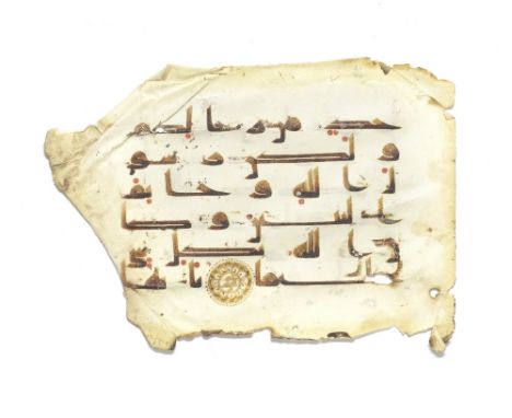 A leaf from a manuscript of the Qur'an written in kufic script on vellum Near East or North Africa, 9th-10th CenturyArabic ma