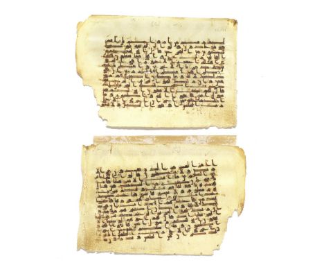 Two consecutive leaves from a manuscript of the Qur'an written in kufic script on vellum Near East or North Africa, 9th-10th 
