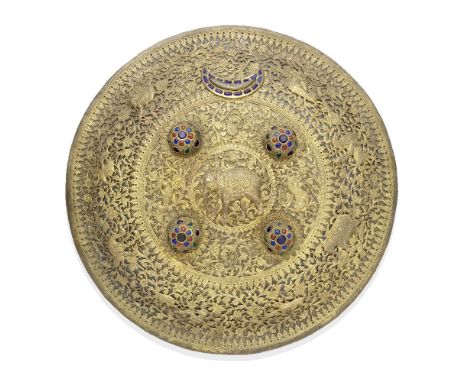 A gilt-copper mounted brass shield Kutch, late 19th Centuryof convex form with four bosses and surmounted by crescent motif, 