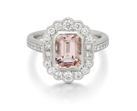 A PLATINUM MORGANITE AND DIAMOND CLUSTER RING an octagonal-cut morganite within a milgrain border of round brilliant-cut and 