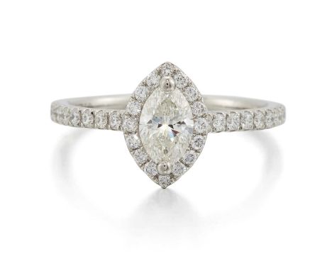 A PLATINUM MARQUISE-CUT DIAMOND CLUSTER RING a marquise-cut diamond within a diamond-set border and to diamond-set shoulders.