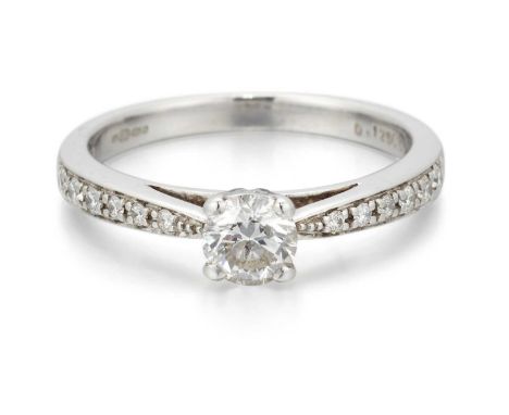 AN 18 CARAT WHITE GOLD SOLITAIRE DIAMOND RING a round brilliant-cut diamond to diamond-set shoulders. Estimated principal dia