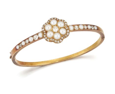 A LATE 19TH CENTURY DIAMOND AND SPLIT PEARL HINGE OPENING BANGLE an old-cut diamond within a lobed border of split pearls and