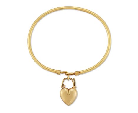 A PADLOCK BANGLE the plain wire bangle with a hook fitting and secured with a heart-shaped padlock clasp. Marked '9CT', 5.5cm