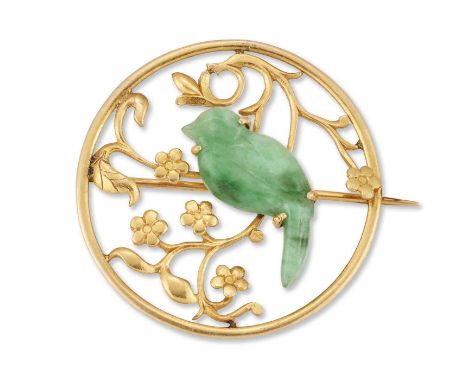 A LATE 19TH CENTURY AESTHETIC JADE BROOCH a jade sparrow perched upon a prunus bough within a pierced circular frame. Unmarke