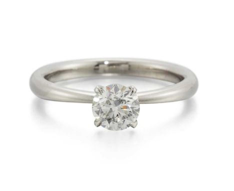 A PLATINUM SOLITAIRE DIAMOND RING a round brilliant-cut diamond in a claw setting. Principal diamond weight 0.710ct, hallmark