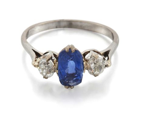 A SAPPHIRE AND DIAMOND THREE STONE RING a cushion-cut sapphire spaced by old-cut diamonds. Estimated total diamond weight 0.4