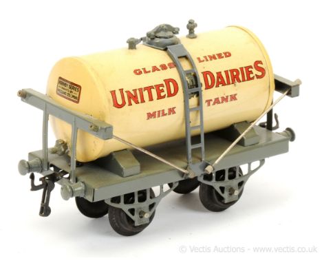 Hornby O Gauge early "United Dairies" Milk Tank Wagon.  Blue/grey base and stanchions, light paint flaking and some restorati