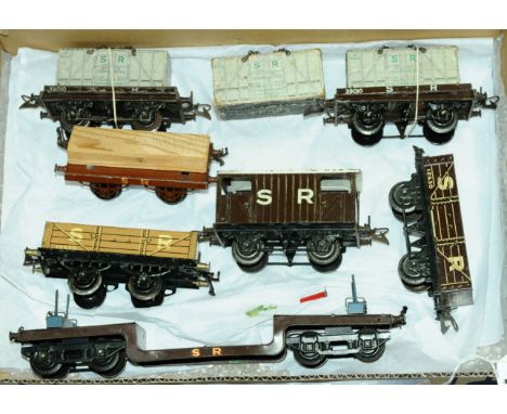 Hornby O Gauge group of pre-war SR Goods Wagons consisting of a No.2 Trolley Wagon, Brake Van, Open Wagon, 2 x Flat Trucks wi