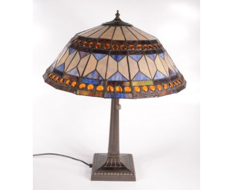 A Tiffany style table lamp with stained leaded glass shade, height 60cm, diameter of shade 50.5cm.