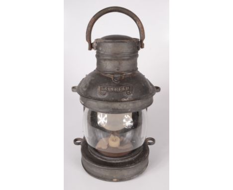 A ship's metal masthead lamp, height 26cm, width 18cm.