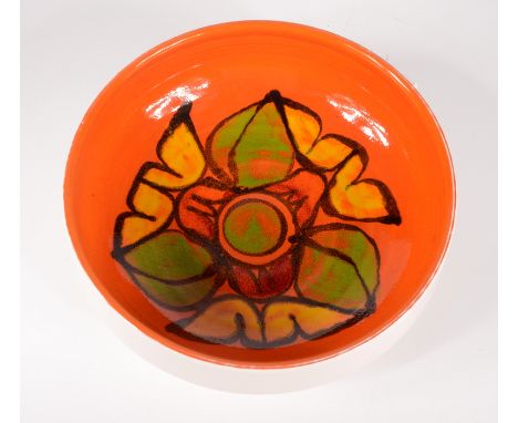 A Poole pottery bowl, No.89, the orange ground with polychrome abstract designs, height 9cm, diameter 23cm. 