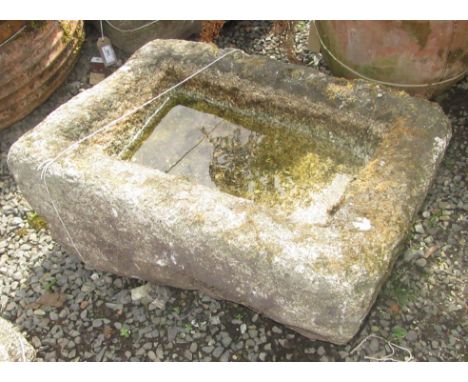 A rectangular granite trough, height 27cm, length 58cm, width 40cm.