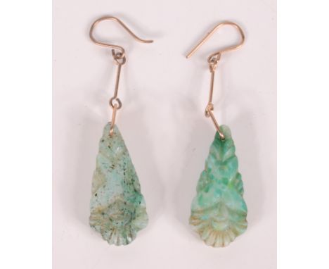 A pair of Chinese carved jade earrings. 
