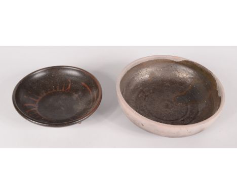 A small studio pottery bowl with tenmoku glaze, red abstract decoration, painted initials P.S. to base, height 3.5cm, diamete