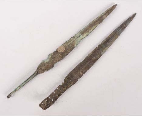 Two bronze blades, one with a guarantee from the Fossil Shop, Hexham stating it to be Roman, found in Syria circa 1000BC, the