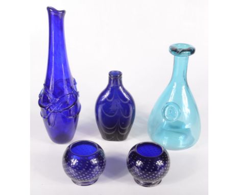 A Bristol blue glass flask with wavy decoration, height 16.5cm, two squat footed blue glass bowls, height 7cm and a similar s