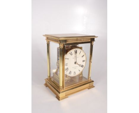 A Sewills Liverpool four glass St George mantle clock, the circular white enamel dial with Roman numerals, in a gilt metal ca