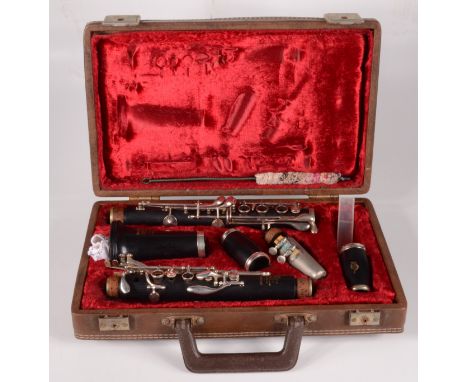 A Boosey & Hawkes, London Emperor clarinet, No.926 and No.484141 in a red velvet lined fitted case. 